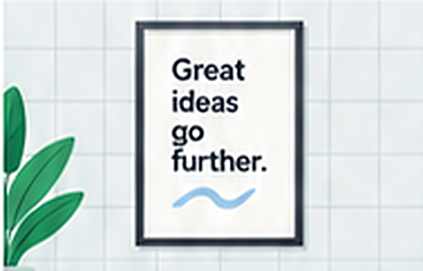 A framed poster reading "Great ideas go further." beside a plant